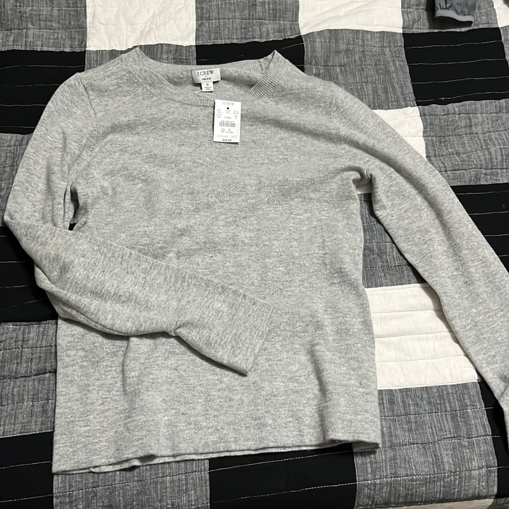 Woman’s J Crew Teddie sweater in a size Small. Never been worn. New with tags.